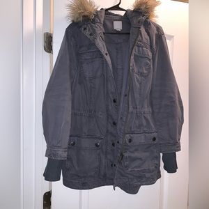 Navy blue parka with fur hood.